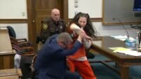 woman charged in grisly murder a
